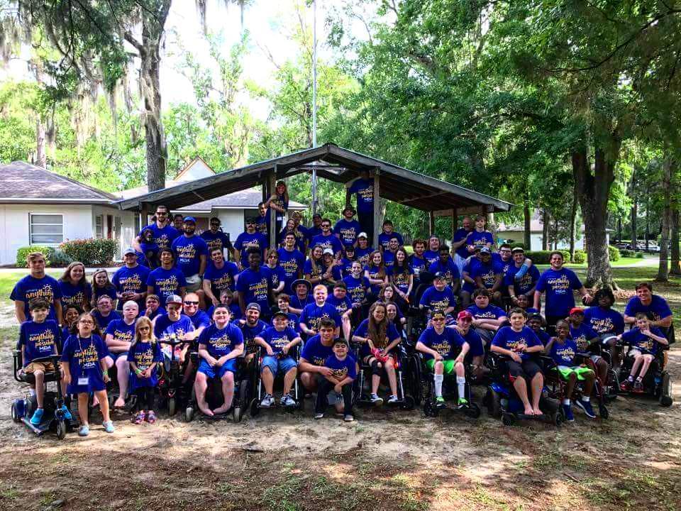 A large group of campers and counselors in matching shirts at MDA Summer Camp.